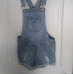 Blue distressed denim overall shorts.